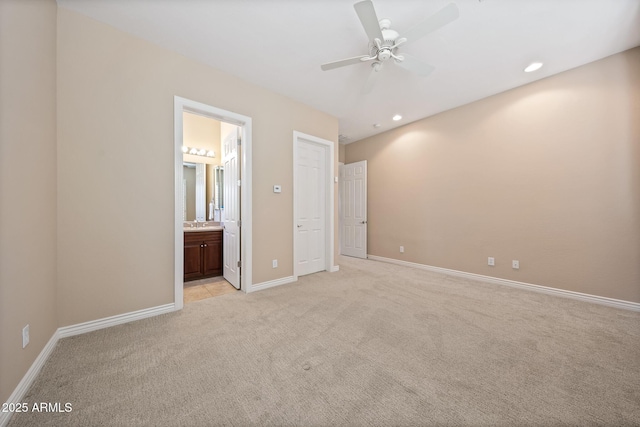 unfurnished bedroom with recessed lighting, baseboards, and light colored carpet