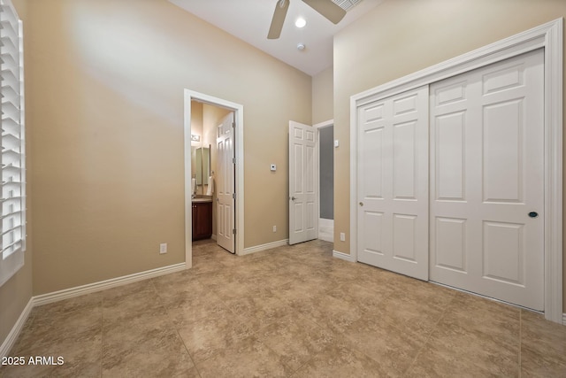 unfurnished bedroom featuring visible vents, baseboards, a ceiling fan, connected bathroom, and a closet