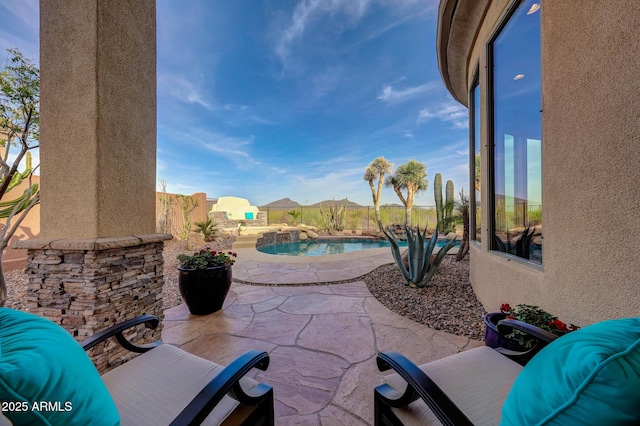 view of patio with a fenced backyard and an outdoor pool