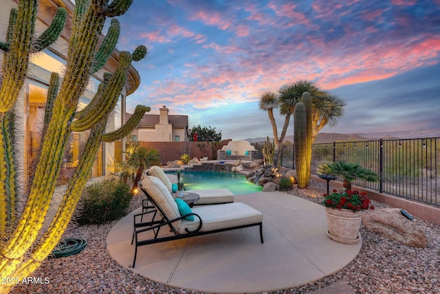 view of patio / terrace featuring a fenced in pool and a fenced backyard