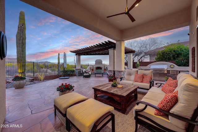 view of patio / terrace with an outdoor living space with a fireplace, a fenced backyard, ceiling fan, and a pergola