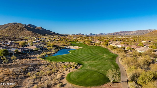 view of mountain feature with a water view, a residential view, and golf course view