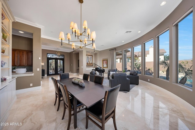 dining room featuring baseboards, ornamental molding, french doors, a chandelier, and recessed lighting