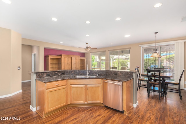 kitchen with dark wood-style flooring, recessed lighting, dishwasher, and a sink