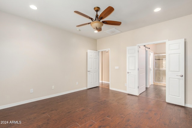 unfurnished bedroom with dark wood-type flooring, recessed lighting, and baseboards