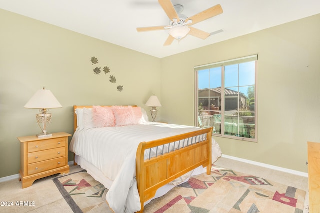 bedroom featuring ceiling fan, baseboards, and carpet floors