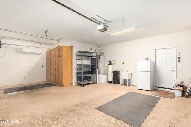 garage featuring water heater, a garage door opener, freestanding refrigerator, and a sink