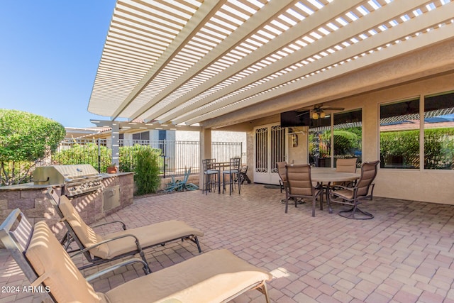 view of patio with a pergola, fence, a grill, exterior kitchen, and outdoor dining area