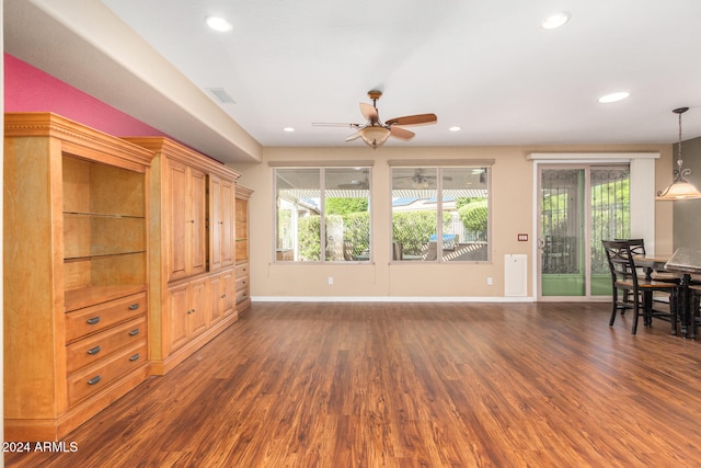 living room featuring recessed lighting, plenty of natural light, and wood finished floors