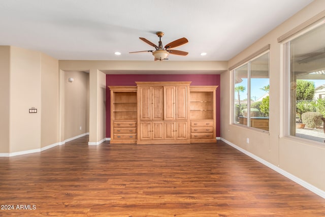 unfurnished bedroom featuring recessed lighting, dark wood-type flooring, and baseboards