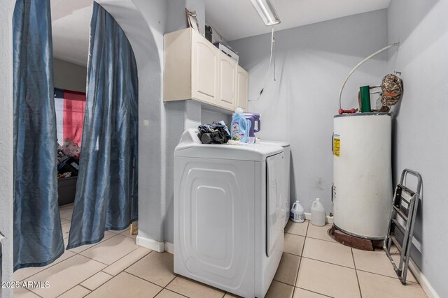 418 E Houser Ave, Buckeye, AZ 85326 - clothes washing area with independent washer and dryer, water heater, light tile patterned floors, and cabinet space