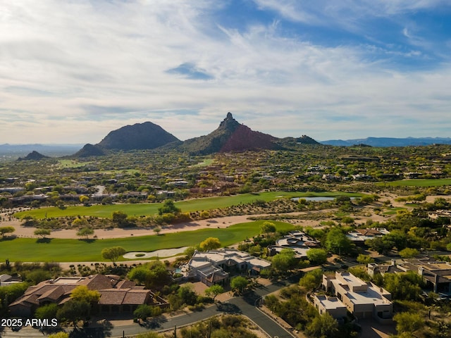 drone / aerial view with a residential view, golf course view, and a mountain view