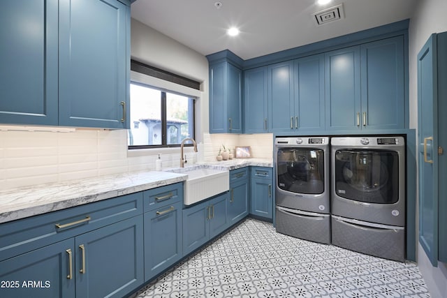 laundry room with a sink, visible vents, recessed lighting, cabinet space, and washer and dryer