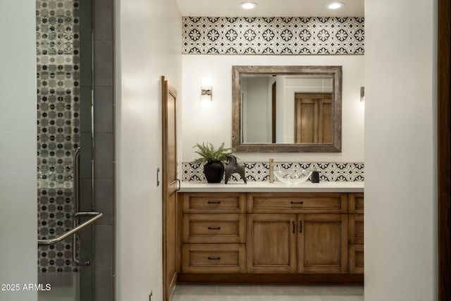 full bath featuring vanity and a stall shower
