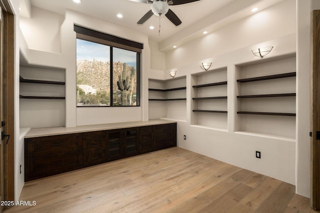 interior space with ceiling fan, recessed lighting, built in features, and light wood-type flooring