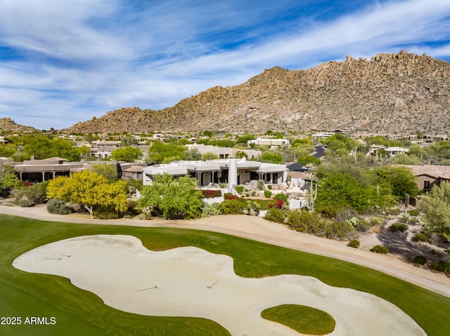 view of property's community featuring view of golf course, a mountain view, and a residential view