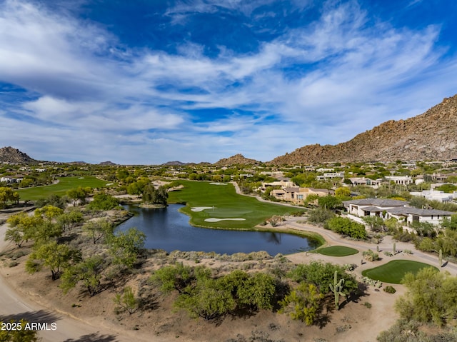 surrounding community with a water and mountain view, a residential view, and view of golf course