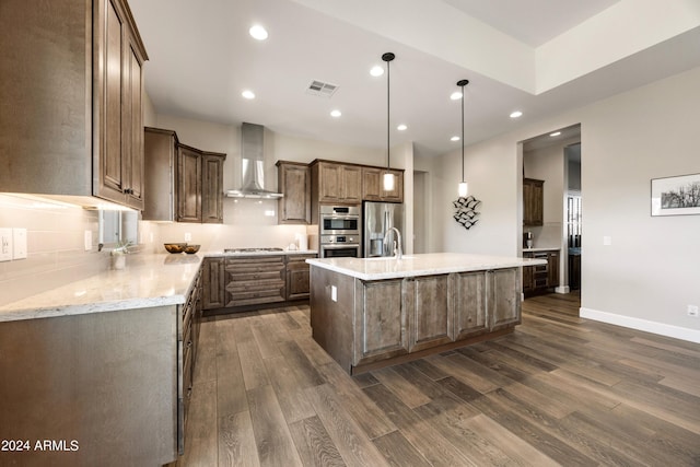 kitchen featuring appliances with stainless steel finishes, visible vents, dark wood-type flooring, and wall chimney exhaust hood