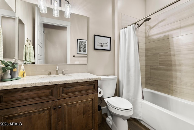 full bath with decorative backsplash, vanity, toilet, and shower / bath combo with shower curtain