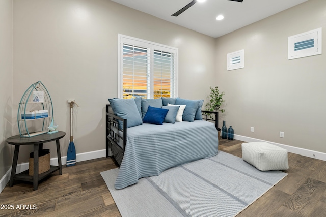 bedroom featuring recessed lighting, dark wood finished floors, and baseboards