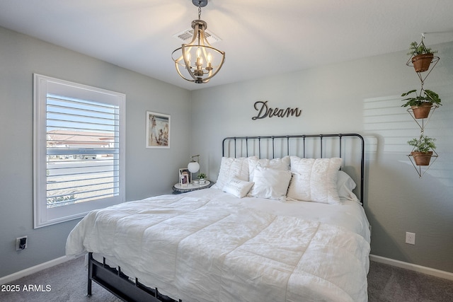 bedroom with baseboards, carpet, visible vents, and an inviting chandelier