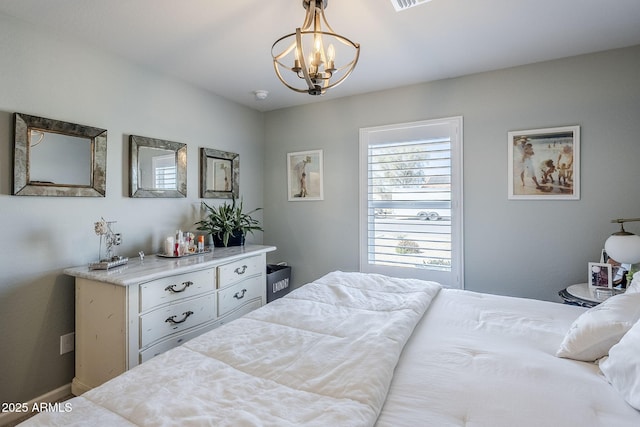 bedroom featuring a chandelier and visible vents