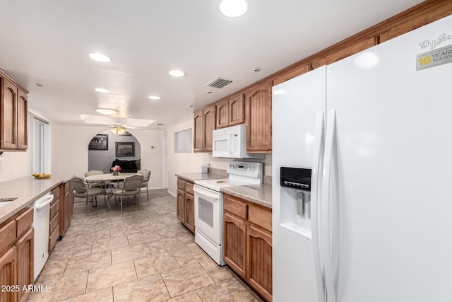 kitchen with ceiling fan and white appliances