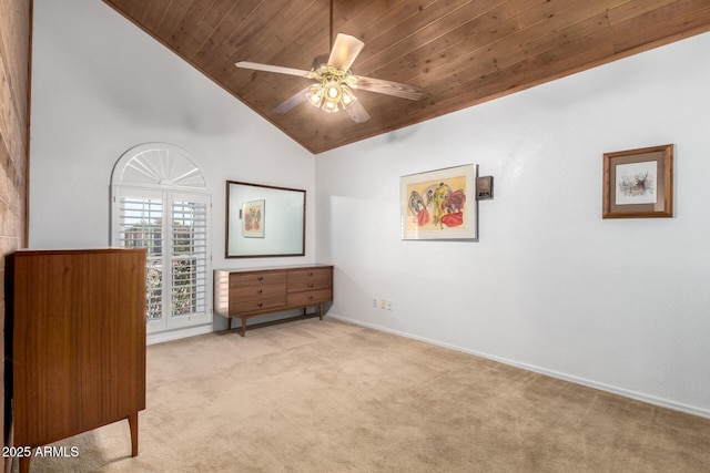 bedroom featuring ceiling fan, light carpet, wood ceiling, and high vaulted ceiling