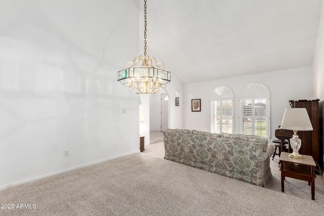 living room featuring carpet, lofted ceiling, and a chandelier