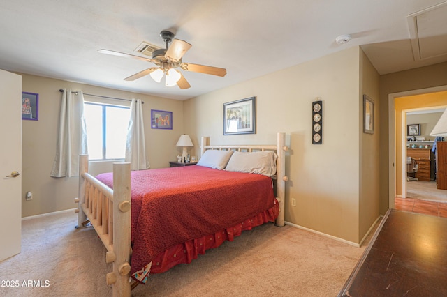 carpeted bedroom featuring attic access, a ceiling fan, visible vents, and baseboards