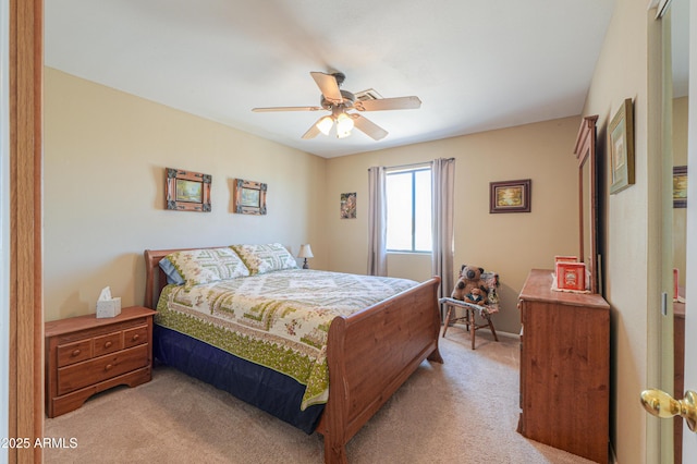 bedroom featuring a ceiling fan and light carpet