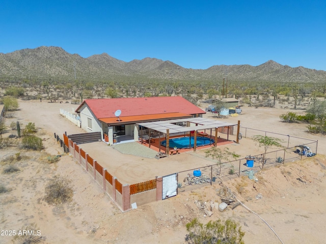 exterior space with a mountain view and a desert view