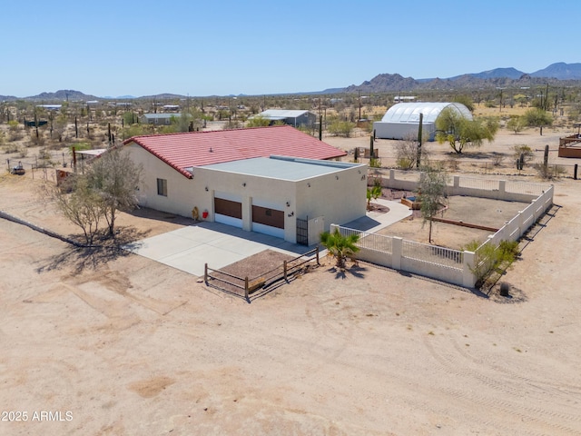 drone / aerial view featuring a mountain view