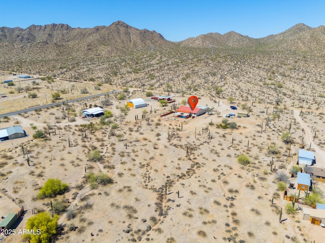 birds eye view of property with a rural view, a mountain view, and a desert view