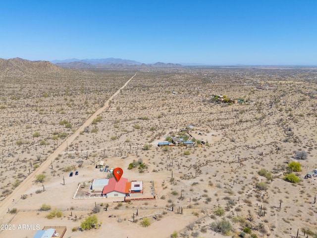 birds eye view of property featuring a mountain view, a rural view, and a desert view