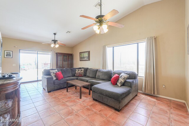 living room featuring light tile patterned floors, visible vents, plenty of natural light, and a ceiling fan