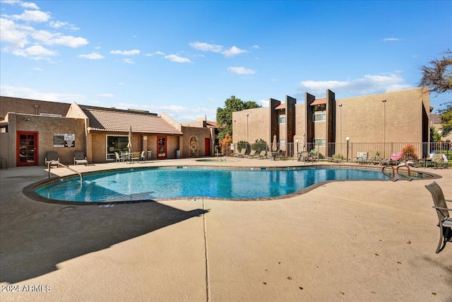 view of pool featuring a patio