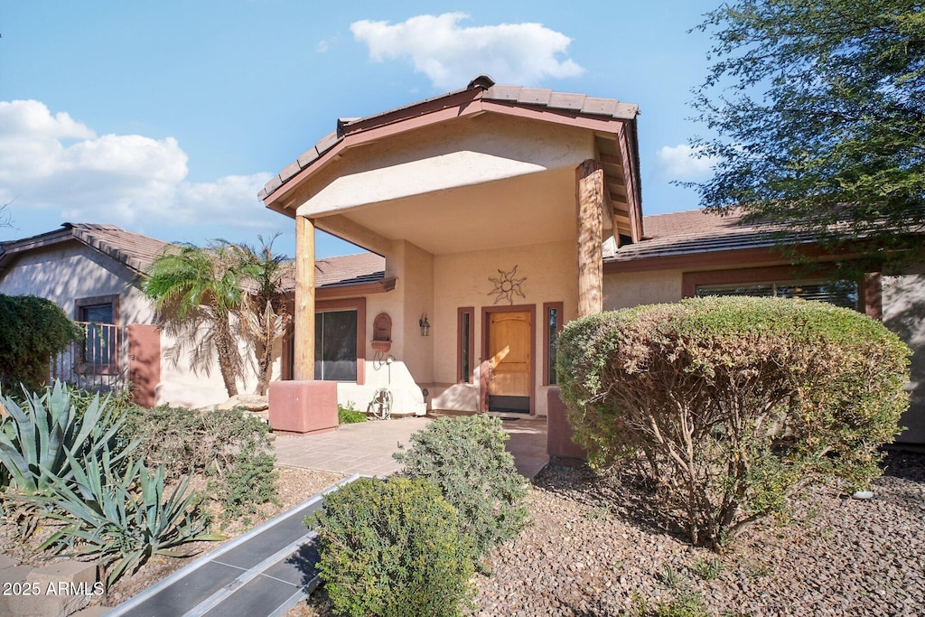 rear view of property featuring a patio