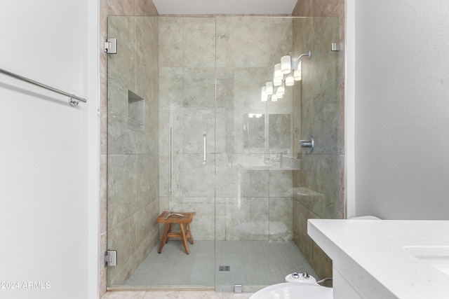 bathroom featuring walk in shower and vanity