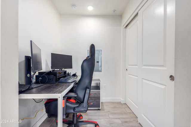 office space featuring baseboards and wood finished floors