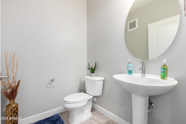 bathroom with tile patterned floors and toilet