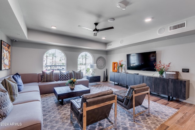 living room featuring hardwood / wood-style flooring and ceiling fan