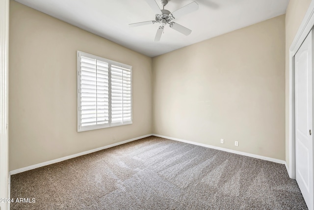 unfurnished bedroom with carpet floors, a closet, and ceiling fan