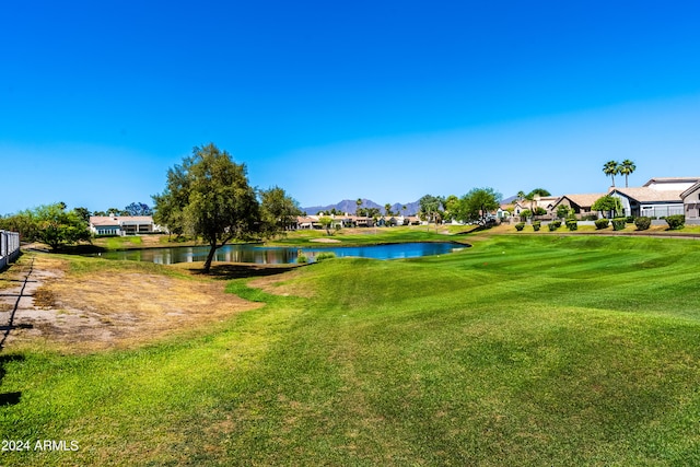 view of home's community featuring a yard and a water view