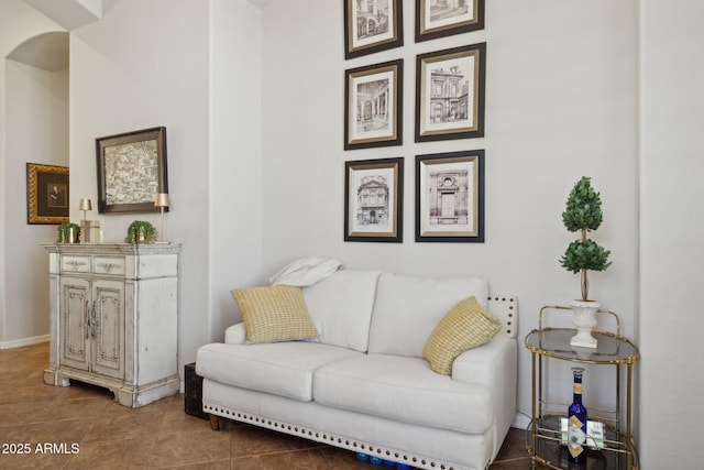 living room with tile patterned floors and baseboards