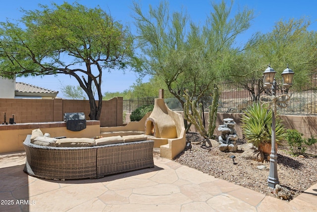 view of patio featuring outdoor lounge area and a fenced backyard