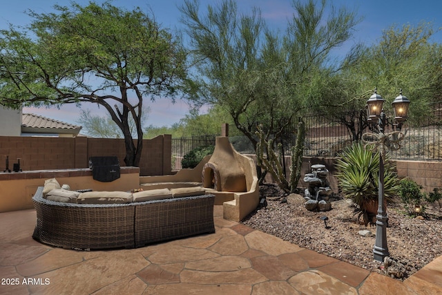 view of patio / terrace featuring an outdoor hangout area and a fenced backyard