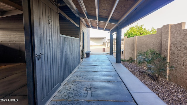 view of patio / terrace featuring fence