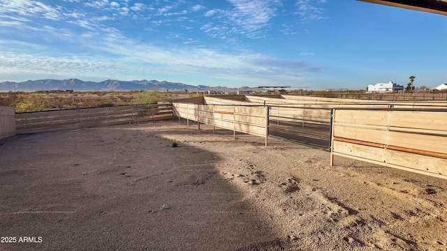 view of yard featuring an exterior structure and a mountain view