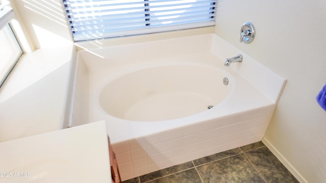 full bath featuring tile patterned flooring and a bath